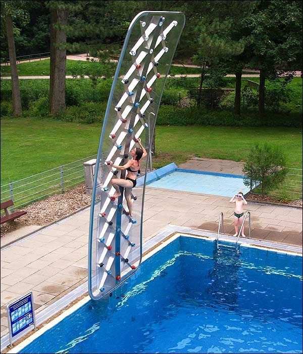 Poolside ROCK CLIMBING WALL?!?!  When I win the lottery, this is a must have!