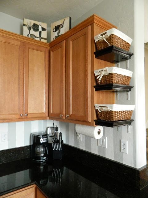 Small Shelves with baskets attached to cabinets Might do this in the new house