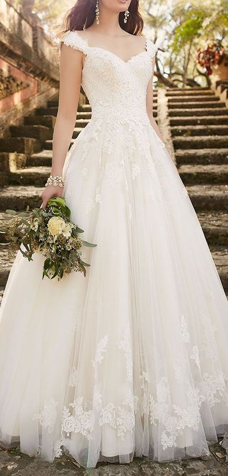 The lace wedding dress with cap sleeves is an instant classic from Essense of Australia