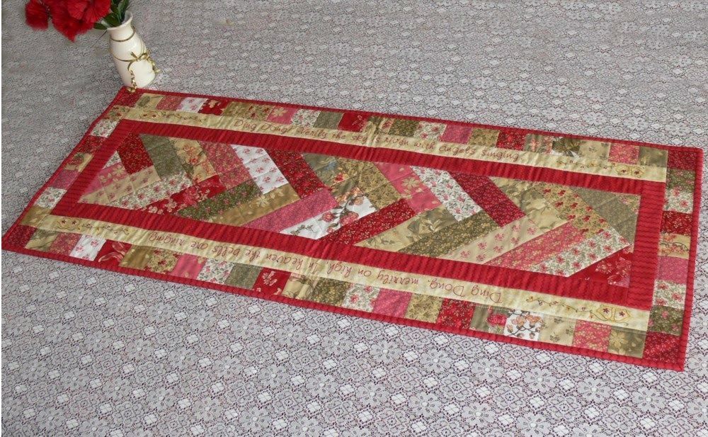 This beautiful table runner is worked in French Braid patchwork and is ideal for using Jelly Roll strips. The borders have the