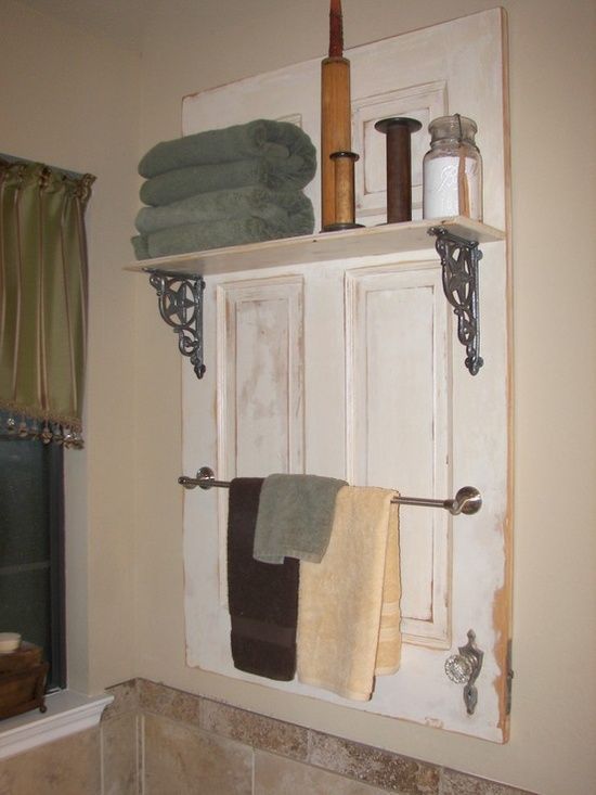 Turn an old door into a bathroom shelf/towel rack  (click picture for 20 Simple and Creative Ideas Of How To Reuse Old Doors)