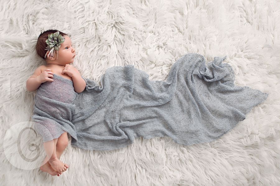 Usually I don’t appreciate the posed newborn pictures but I like this one. Natural pose, with just a little bit added.