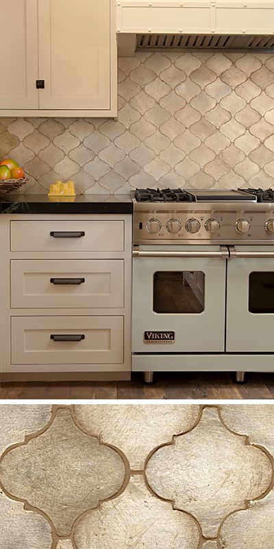 Walker Zanger’s Contessa in Silver Leaf is a beautiful backsplash in this yellow kitchen designed by Karen R. Millet.