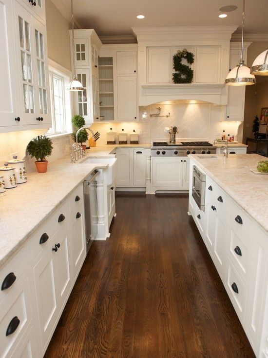 white kitchen, shaker cabinets, hardwood floor, black pulls