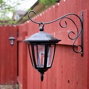 Hang dollar store solar lights on basket hooks. | 41 Cheap And Easy Backyard DIYs You Must Do This Summer