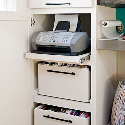 Hidden storage in an existing cabinet by modifying the shelves with sliders for easy access to files and printer. Smart.
