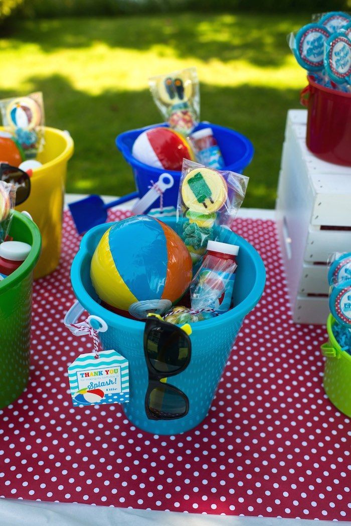 Mini beach balls and sunglasses are a must for this Colorful Pool Party via Kara’s Party Ideas.