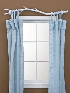 tree branch spray painted serving as a curtain rod– genius! This would be perfect for our owl/tree themed baby room! Totally