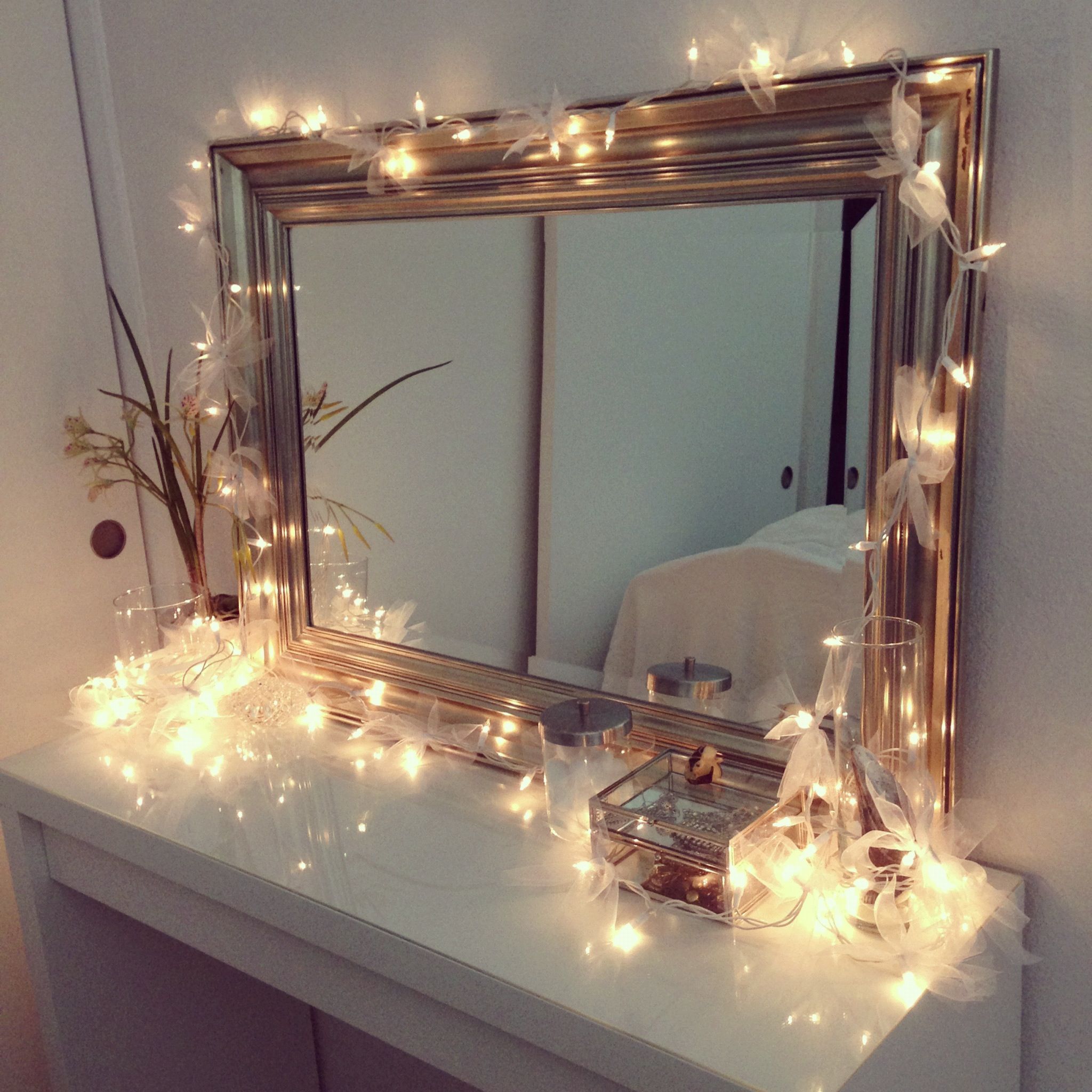 Vanity setup!   Ikea vanity with Christmas lights, decorated in ribbons! Do this for Chest of Drawers