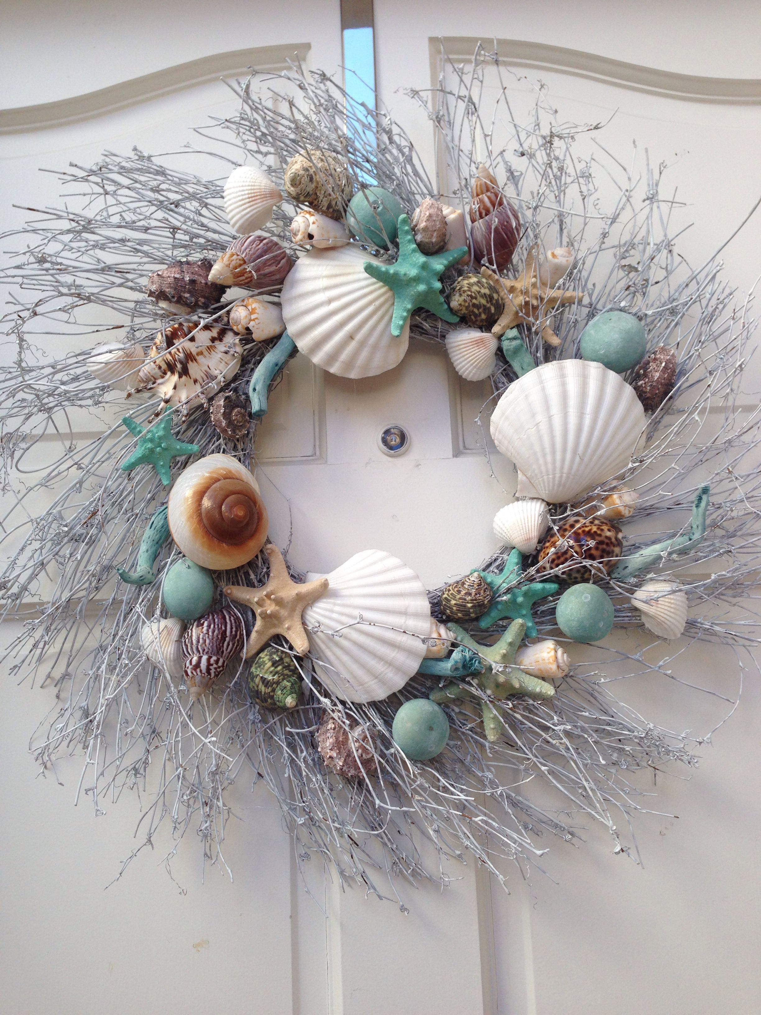 wreaths from dollar store, silver spray paint, and sea decor and hung by ribbon. Florida house