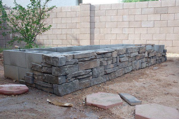 pretty – cover cinder block raised bed with thinset mortar + stone veneer