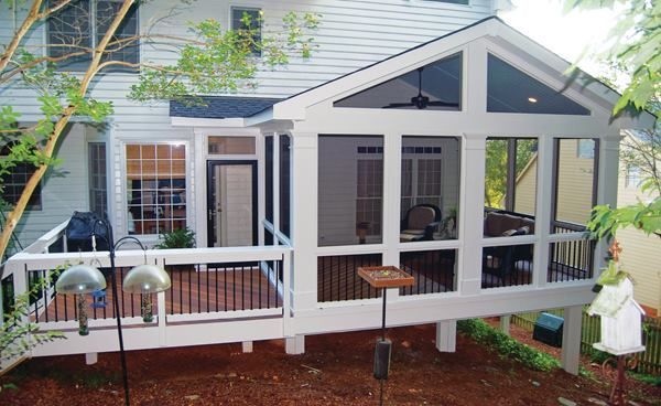 A small extension off this screened porch contains a captured doorway leading out onto the adjacent deck.