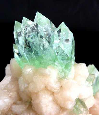 Fluorapophyllite crystals jutting off the top of a beautiful Stilbite matrix / India