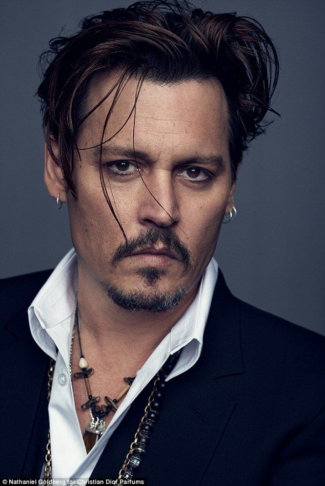 Johnny Depp has ditched the braids and bandanna as he’s unveiled as the face of Dior’s new fragrance