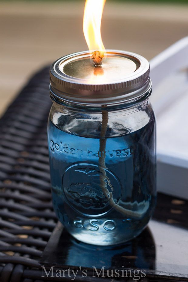 Keep the bugs away in country style by repurposing Mason jars into citronella candles.