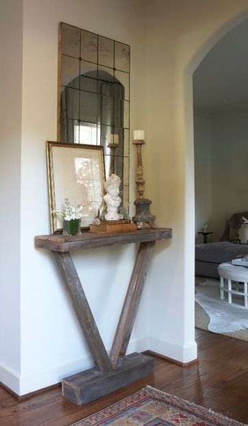 small-entryway table… an easy DIY. Interesting idea. Maybe time to change up the foyer cabinets.