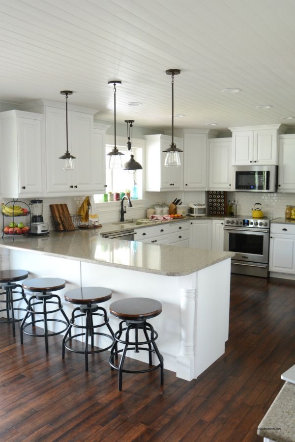 The Idea Room reveals a stunning kitchen remodel complete with updated pendant lights and smudge-proof Fri