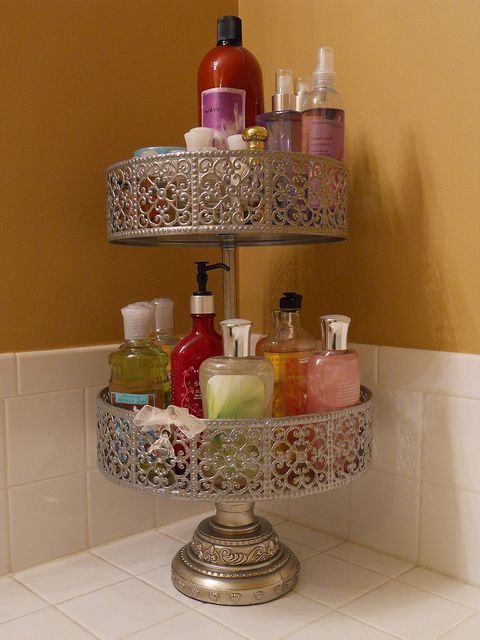 Use cake stands or tiered plant stands to declutter your bathroom counters. Great idea!