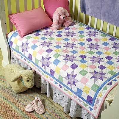 A Star is Born Quilt by Sandra Smith. Pastel prints are perfect for this sweet quilt. The pieced triangles