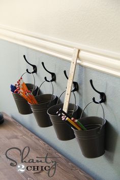 Art supply storage with buckets and hooks! Think it turned out cute. (totally think I could use these for