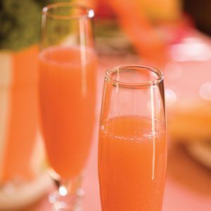 Blushing Mimosas: Orange Juice, Pineapple Juice, Champagne with a splash of grenadine :)