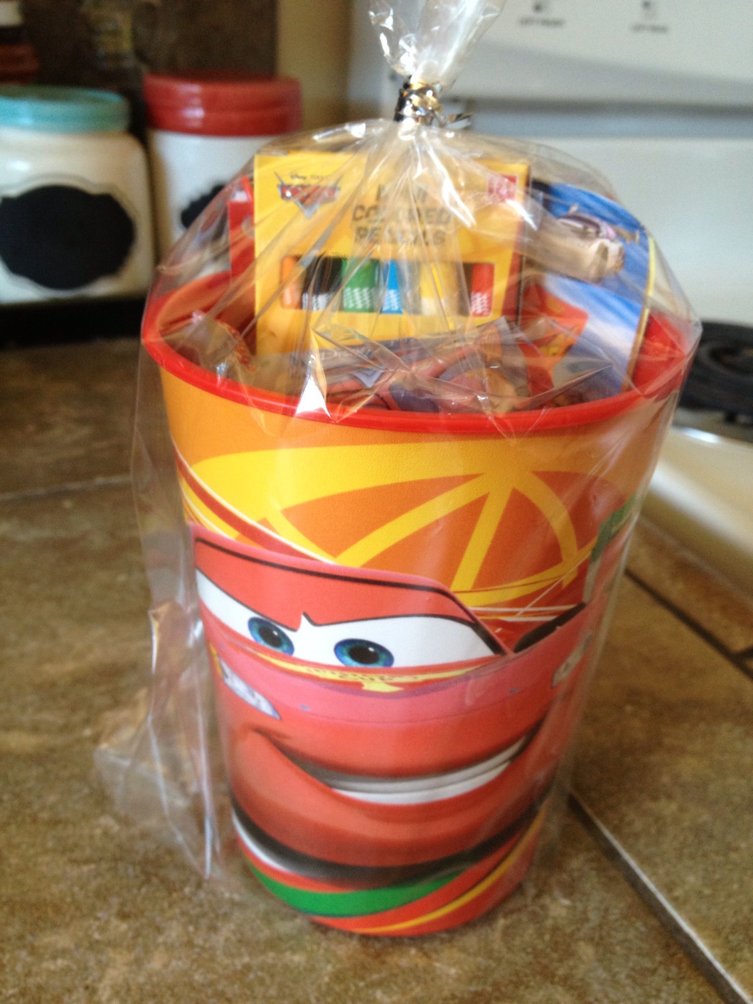 Cars birthday party favor. Plastic cars cup from target filled it with cars crayons, cars notepad, cars st