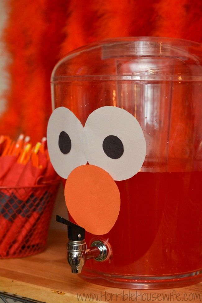 Elmo birthday party ideas- add construction paper eyes and nose to a dispenser full of red punch