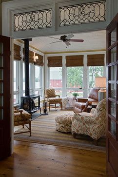 Farmhouse style home farmhouse-sunroom. Stain glass transom between kitchen and porch