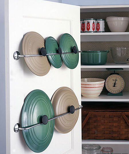 Finally, store kitchen items like pot lids on the back of cupboard doors using towel racks and gravity
