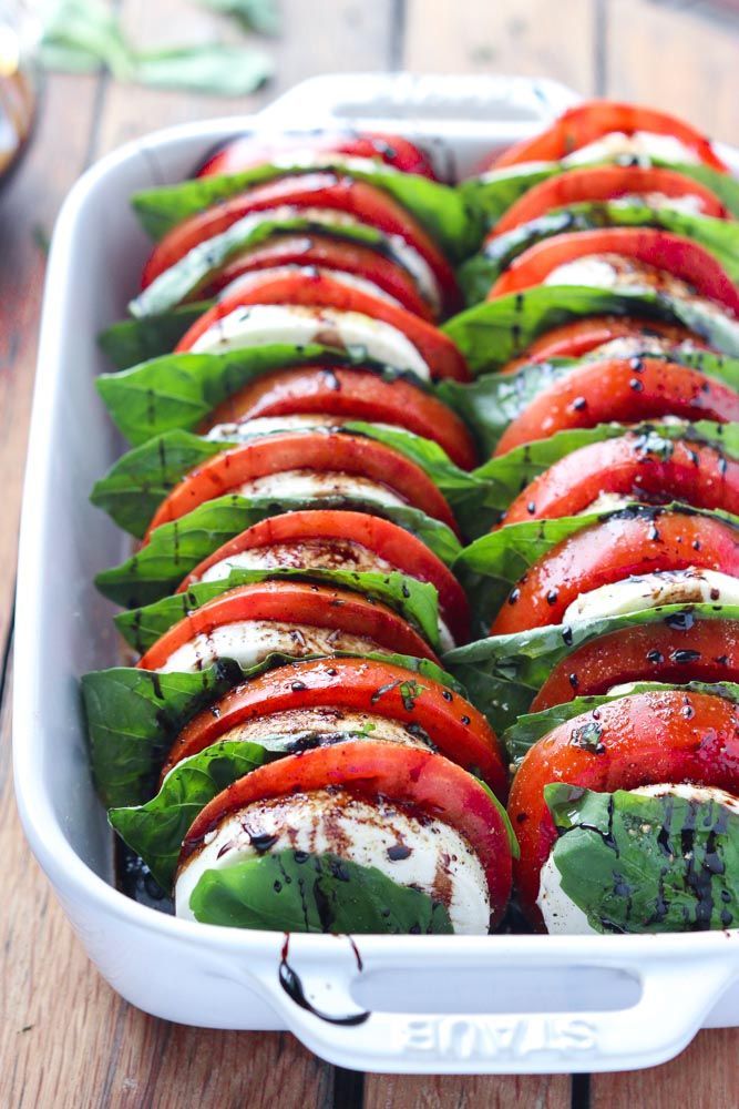 Light and easy appetizer or salad, loaded with tomatoes, fresh mozzarella, basil and balsamic reduction.