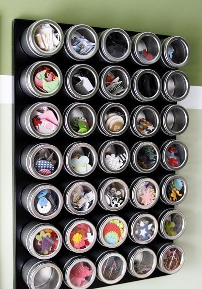 Magnetic board and spices bins for small supplies, probably could be found in Ikea
