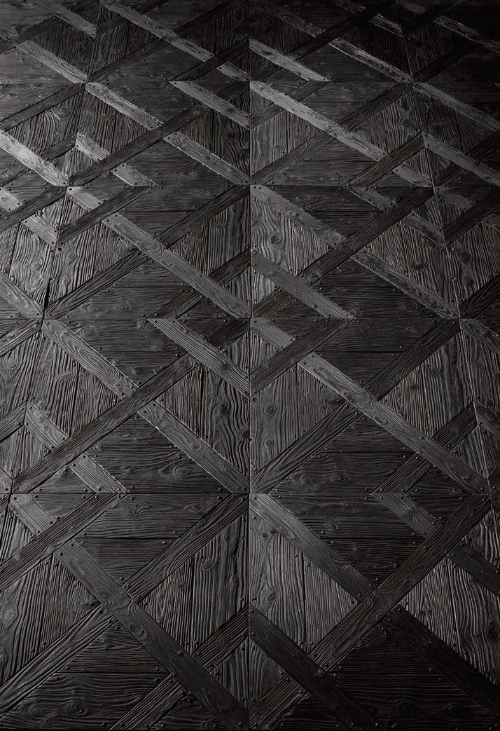 Recycled black parquet flooring by Henry Krokatsis