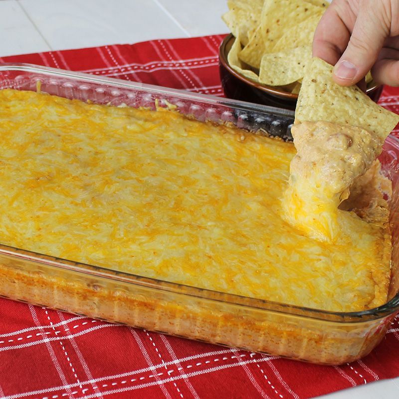 Stop the search! Texas Trash Dip is the ultimate ooey, gooey, cheesy bean dip that’s perfect as a ga