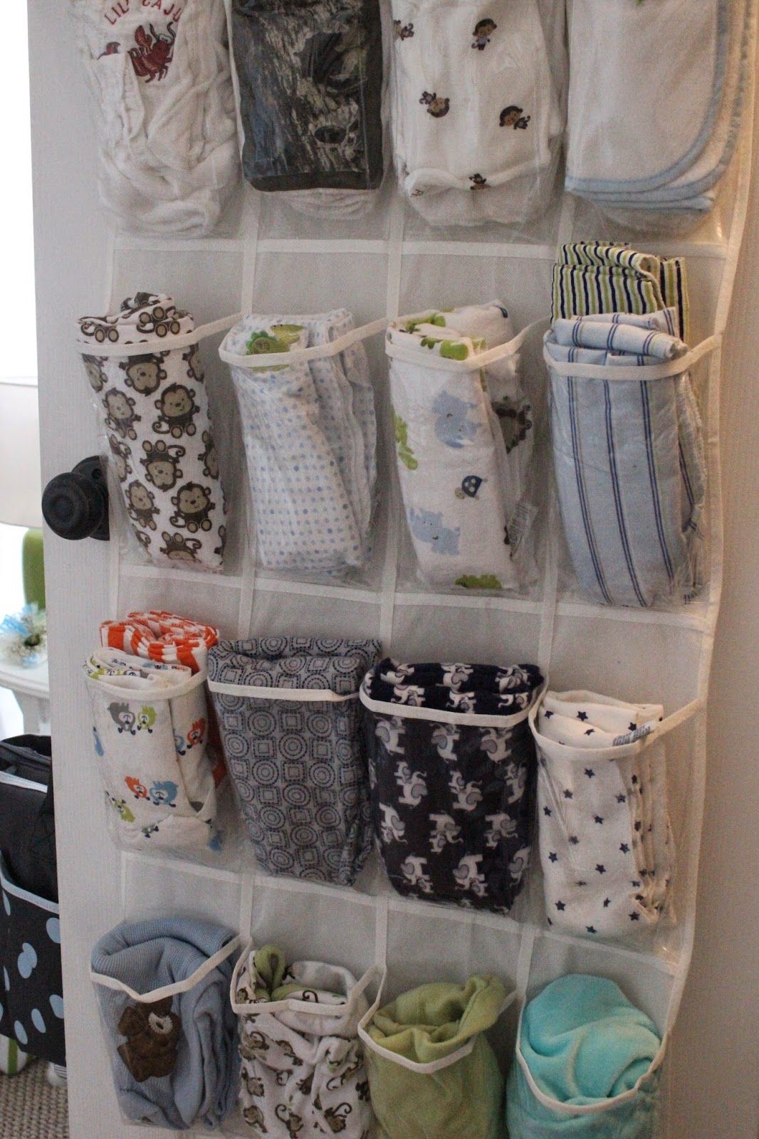 store baby blankets in a hanging shoe storage… brilliant!!!