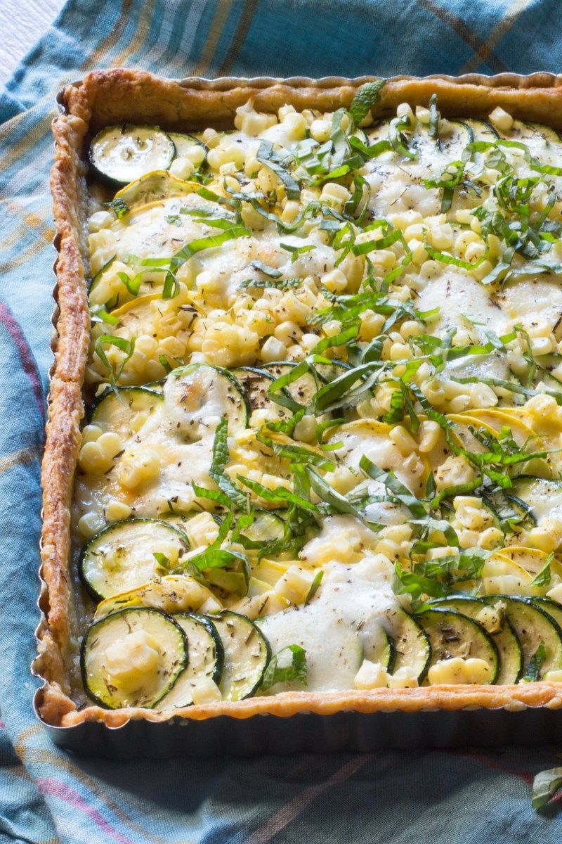 Summer in a Tart! Zucchini, summer yellow squash, corn and mozzarella, all topped off with a spray of mint