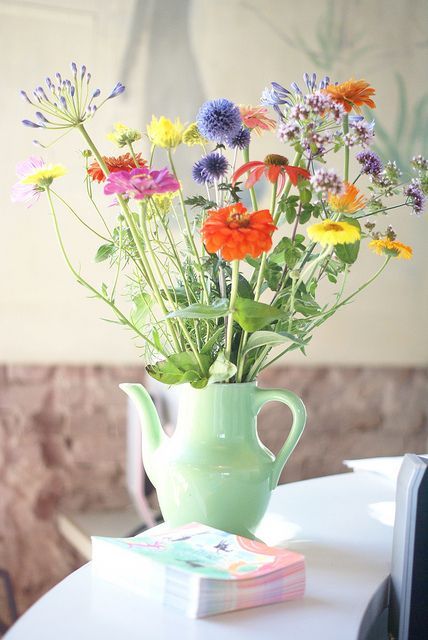 wild and delicate. basically picture perfect. Love that they are placed in a tea pot.
