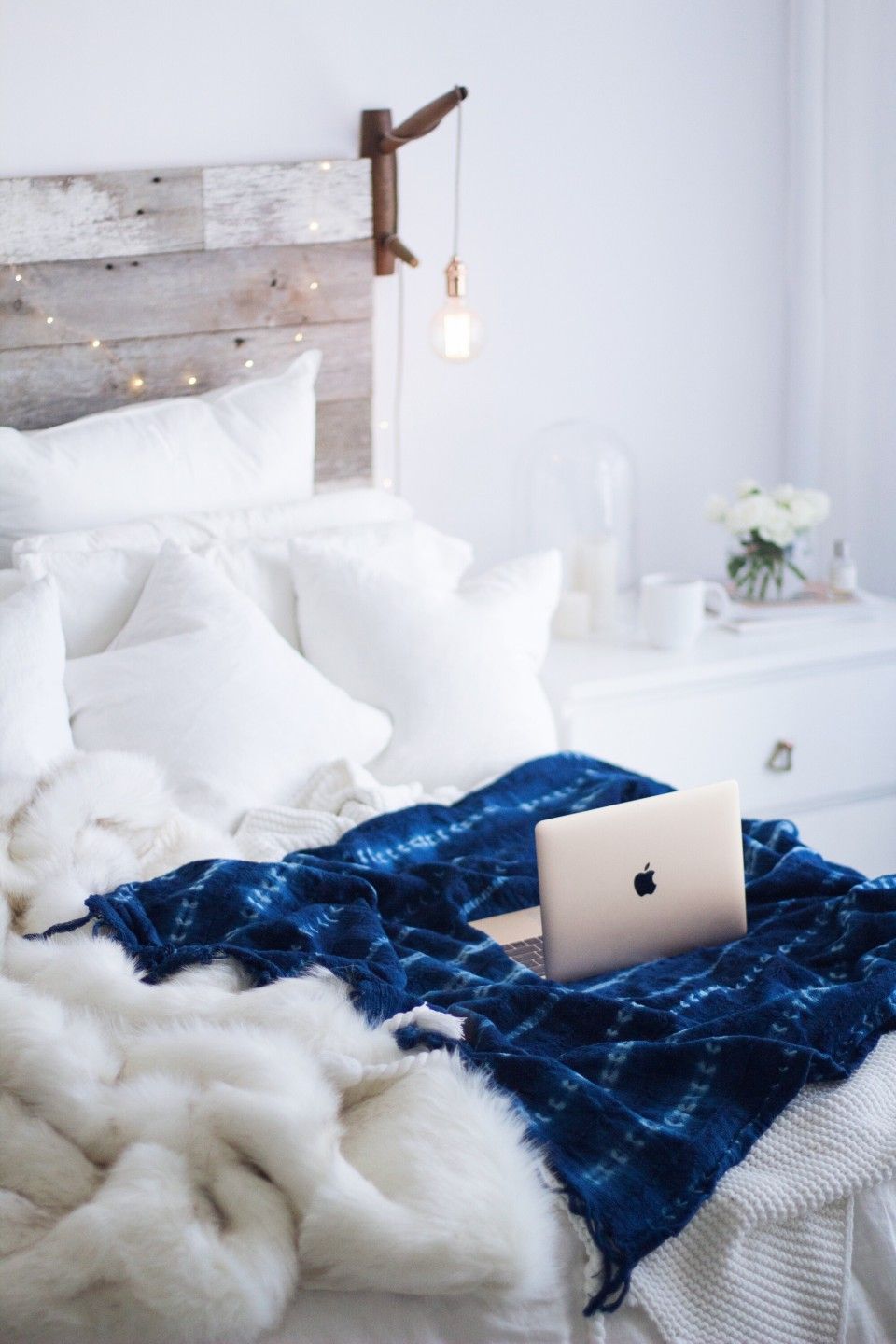 All white bedroom & boho indigo blanket