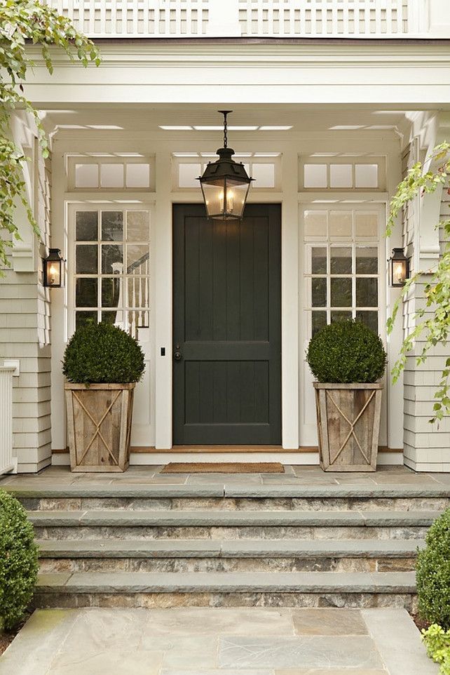 Love the symmetry of a pair of planted urns and the finished touch they add to any front porch