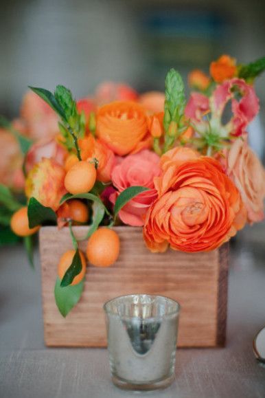 orange flowers in a wood planter photographed by Troy Grover Photographers