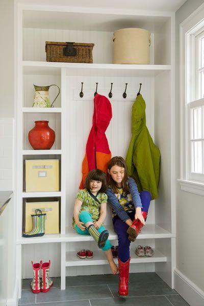 Situated near the back door and away from the cooking zone, this mudroom built-in holds cubbies and a