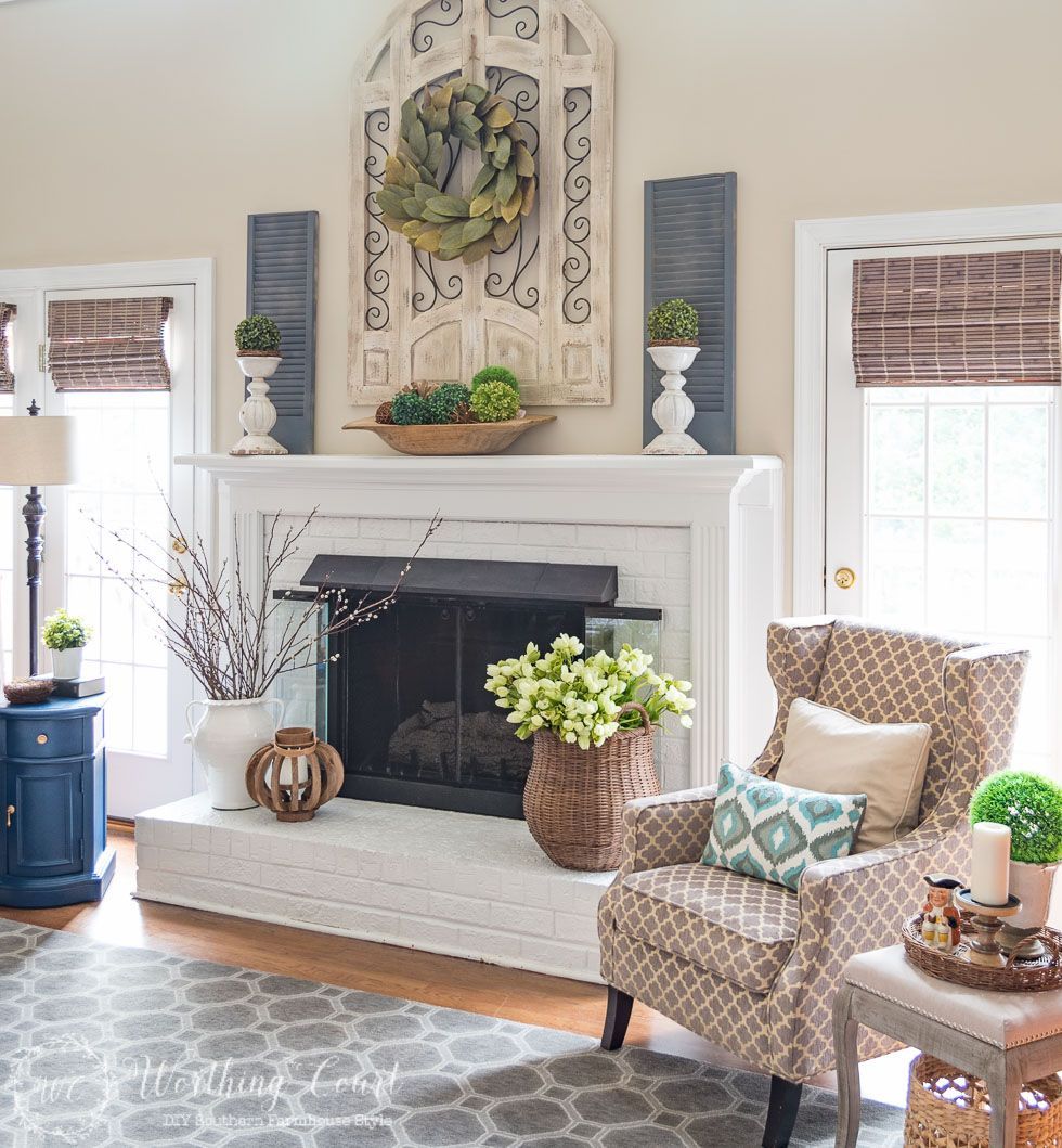 This fireplace celebrates the arrival of spring by filling the mantel and hearth with texture and a mi