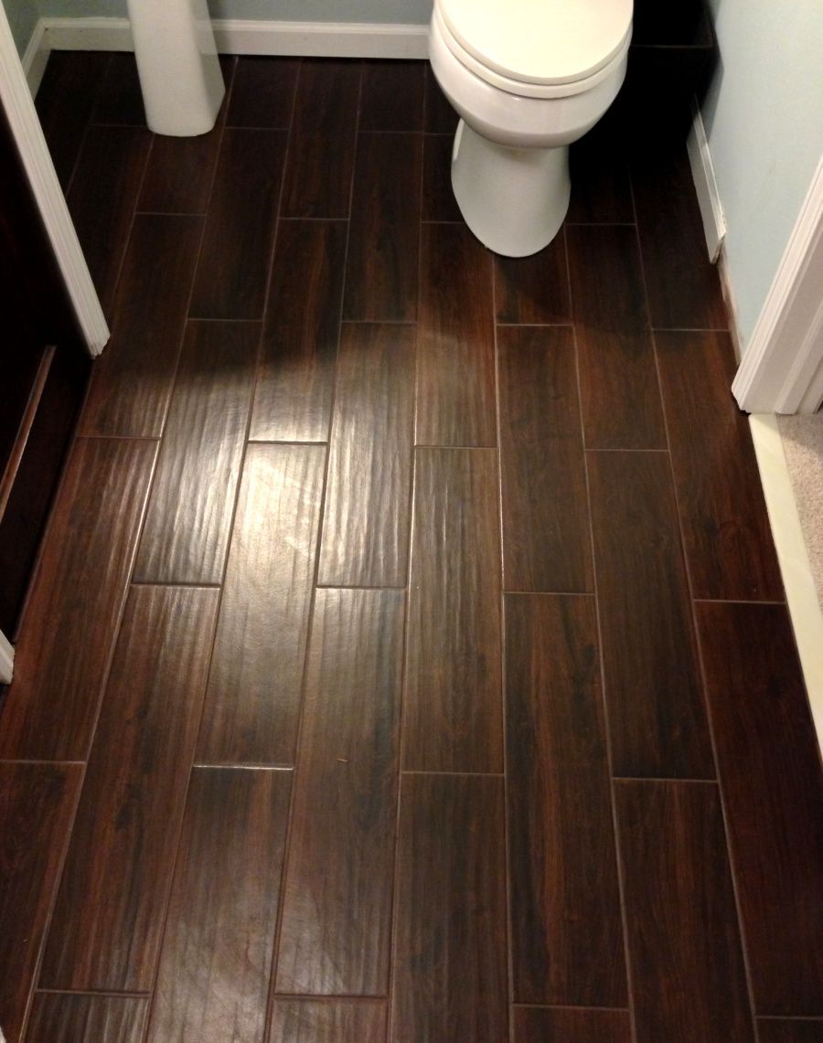 tile that looks like wood… great idea for bathrooms, basements or anywhere else water is likely to b