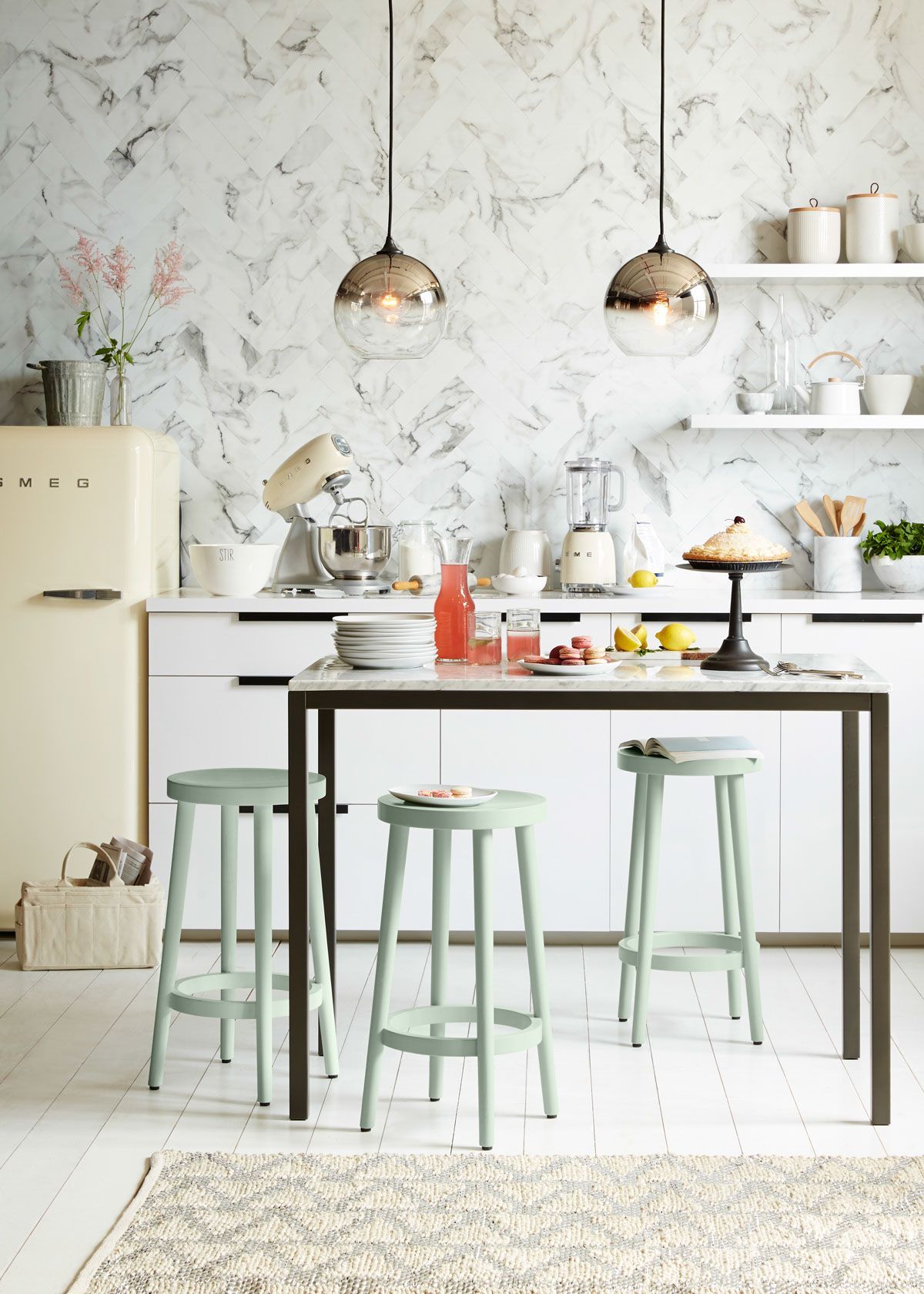 Two Ombre Mirrored Pendant lights from west elm add striking style to this beautiful kitchen. Browse a