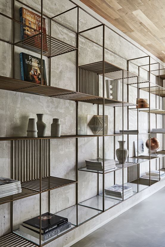 Cement screed wall- metal and glass shelves