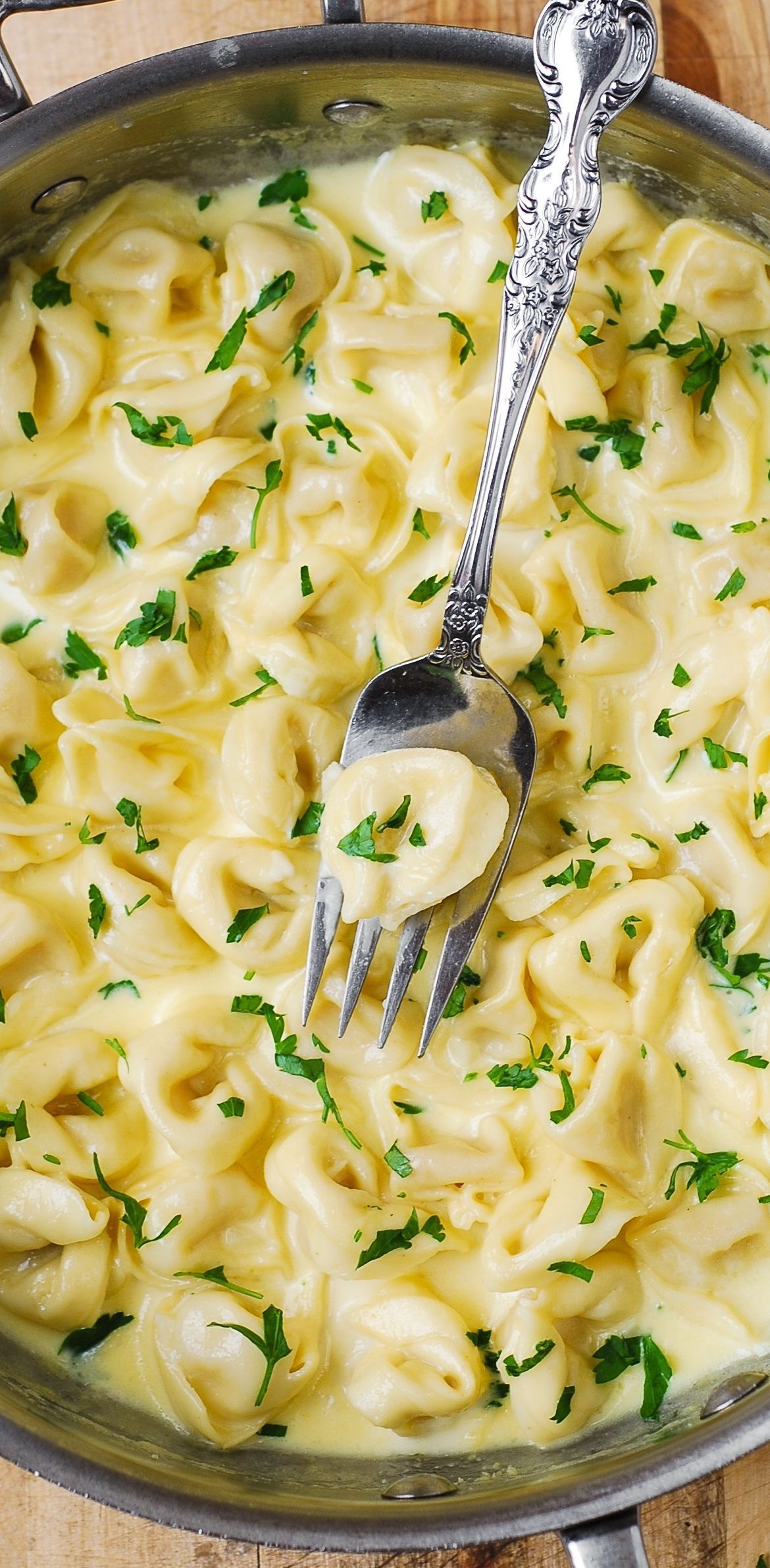Delicious Tortellini smothered in a Creamy Asiago Cheese Garlic Sauce – easy, 30-minute pasta recipe!