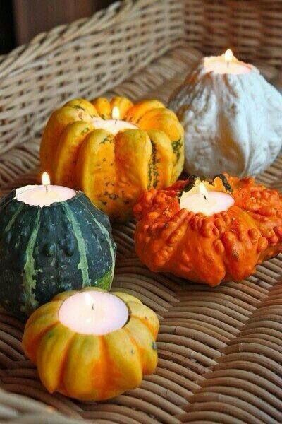 Purchase small pumpkins and carve out a hole in the top large enough for a tealight. Use these in Samh