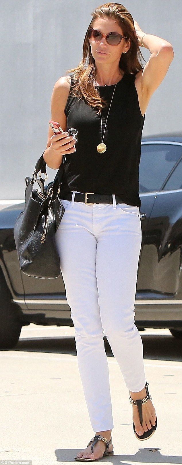 Effortlessly chic: Supermodel Cindy Crawford, 49, looks incredible in white jeans