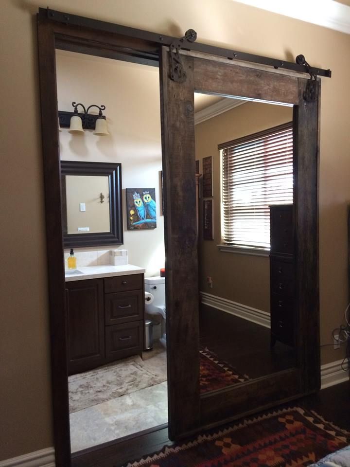 mirrored door to bathroom. genius. mirror on both sides of course