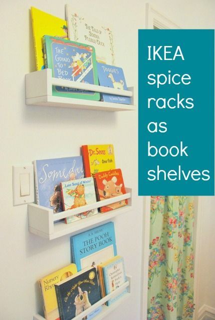 Using IKEA spice racks as bookshelves in a nursery. Great way to have outward faci