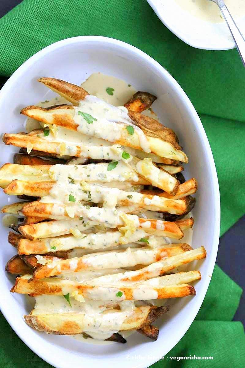 Baked Fries with Garlic Sauce – Russet potato baked and drenched in garlic tahini